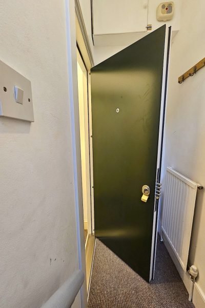 Composite security doors in green.