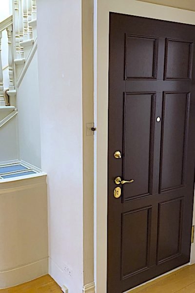 Natural oak wrapped high security doors.