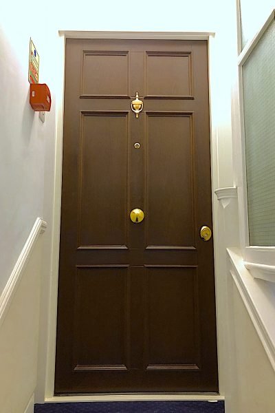 Natural oak cladded security doors.