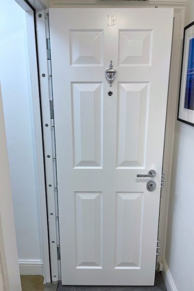 Steel reinforced and timber wrapped high security door installed in London.