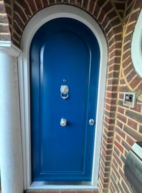 Blue arched security door.