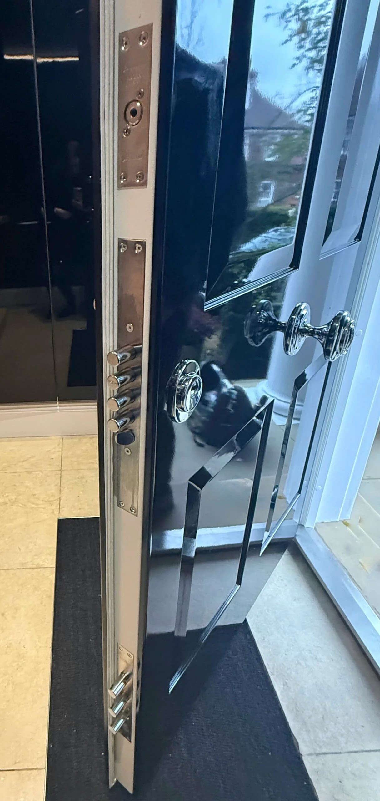 Safety front door with extra locking bolts installed in NW3.